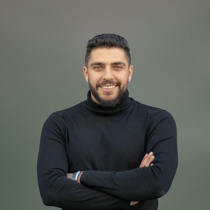 Alex Rivera, Lead Design Curator at DomainBlendPro, reviewing corporate floral arrangements